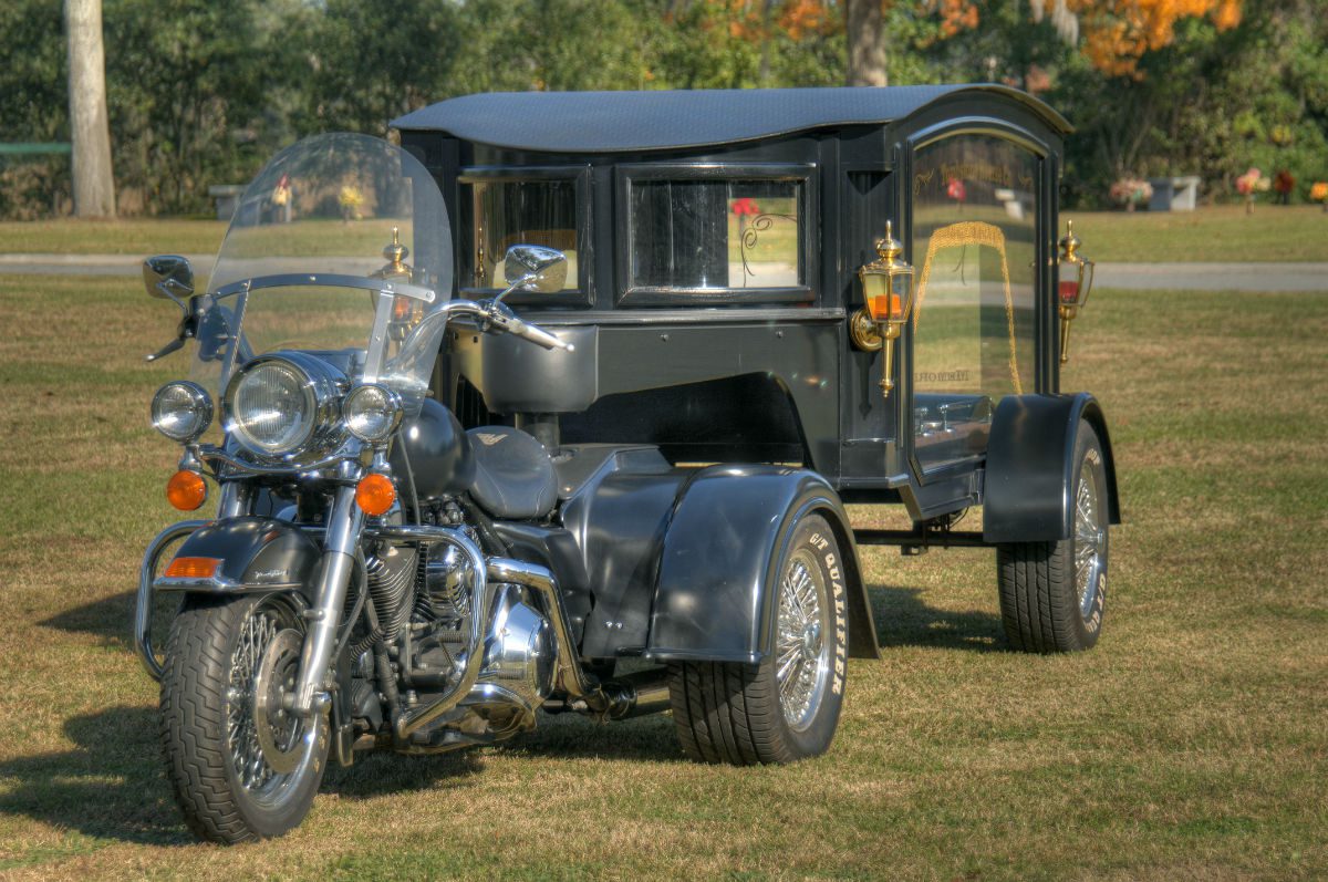 hearse driven by a motorcycle