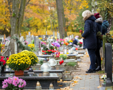 People visiting cemetery