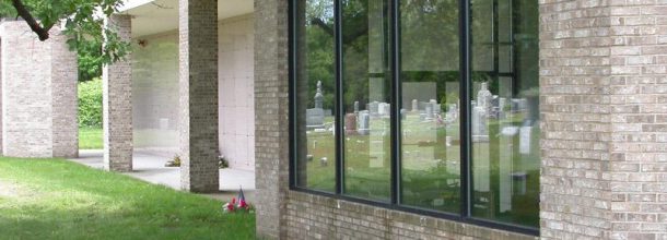 headstones in the window reflection